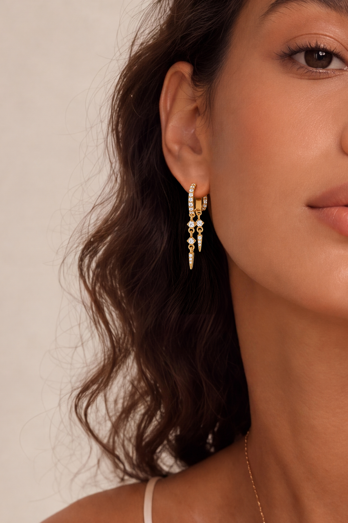 Model wearing Spike Dangle Single Hoop Gold – Clair de Lune