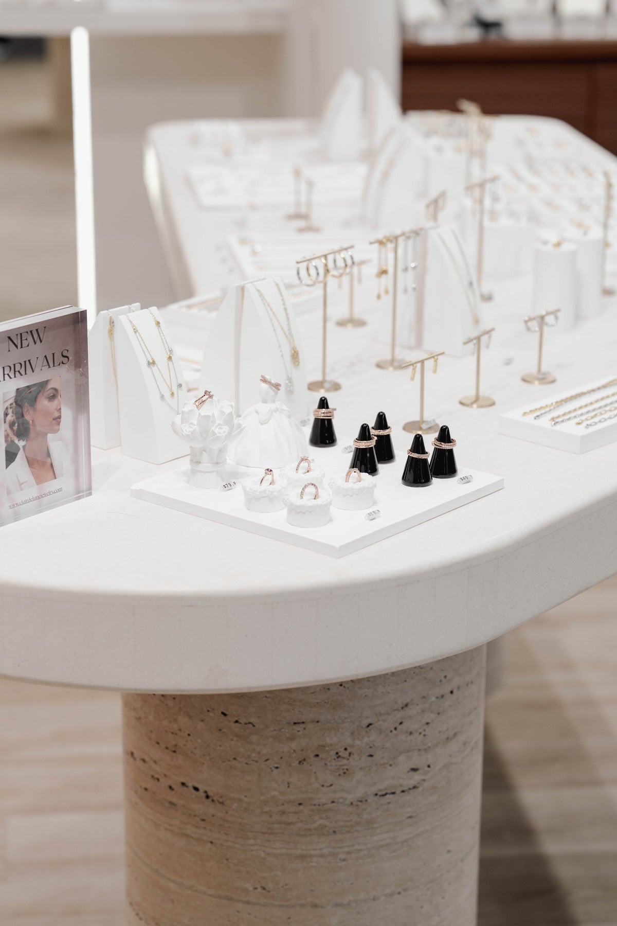 Necklace and earring displays on a round boutique table