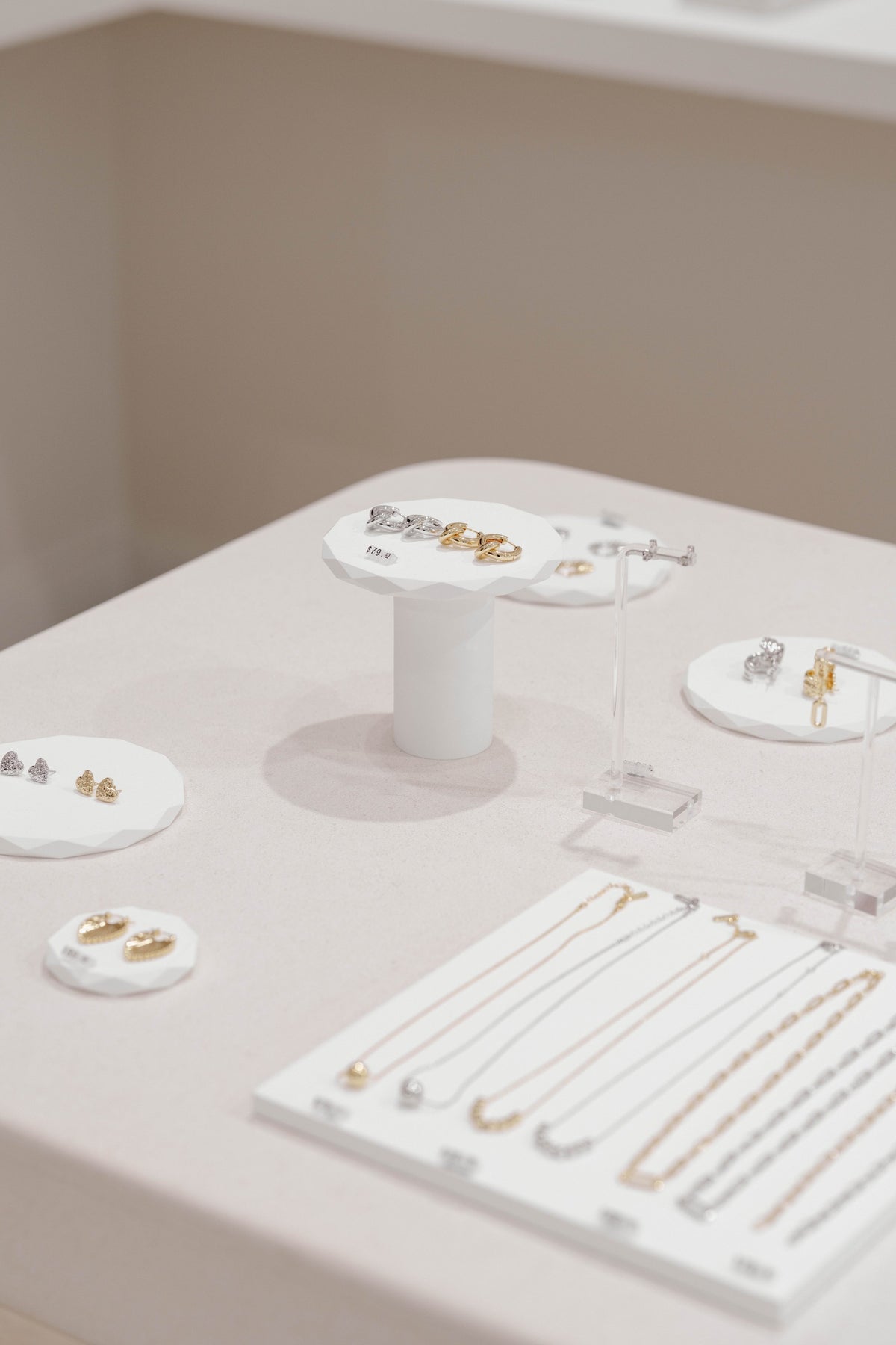 Jewellery arranged on cream display stands in the Warringah Mall boutique